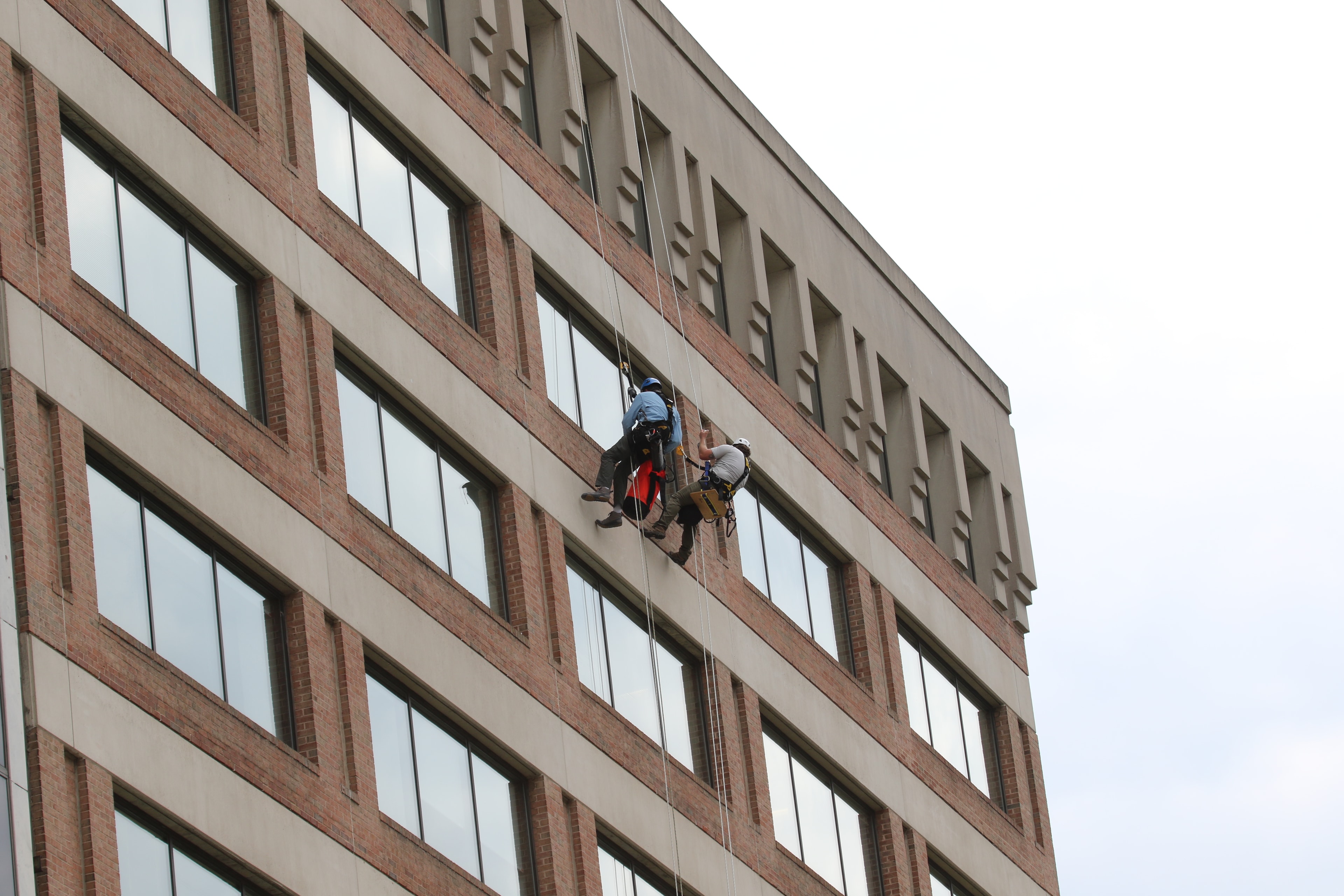 Rope access worker performing exterior building work